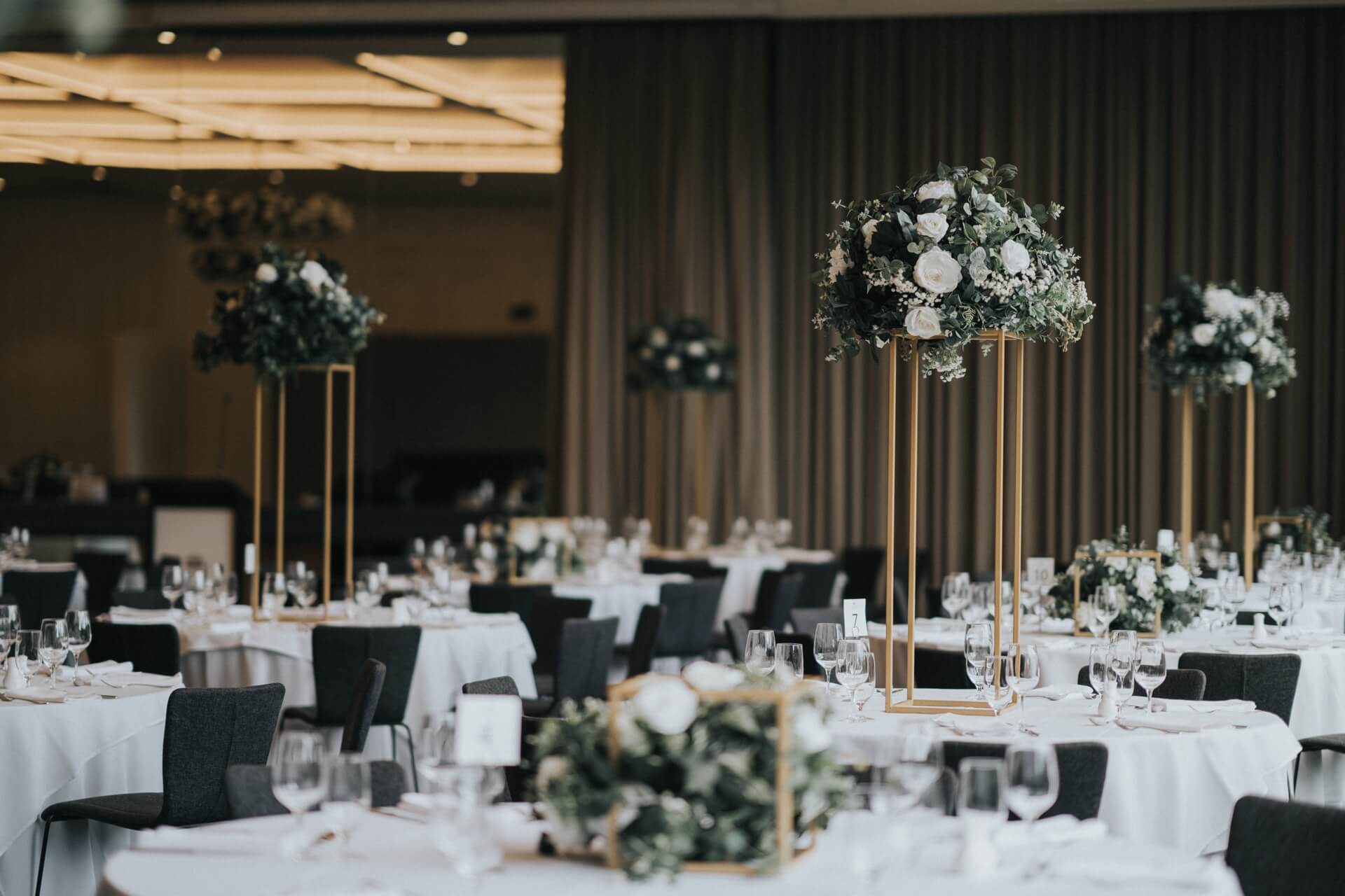 A beautifully decorated wedding reception at Leonda By The Yarra Ballroom, with tables and chairs arranged for guests.