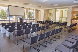 Conference room with chairs and projector screen at Product Launch Venues Melbourne.
